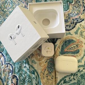 AirPods Pro, not brand new. But with box and replacement pads